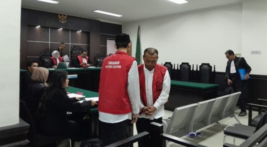 Foto close-up wajah Wadison Pasaribu yang sedang tersenyum